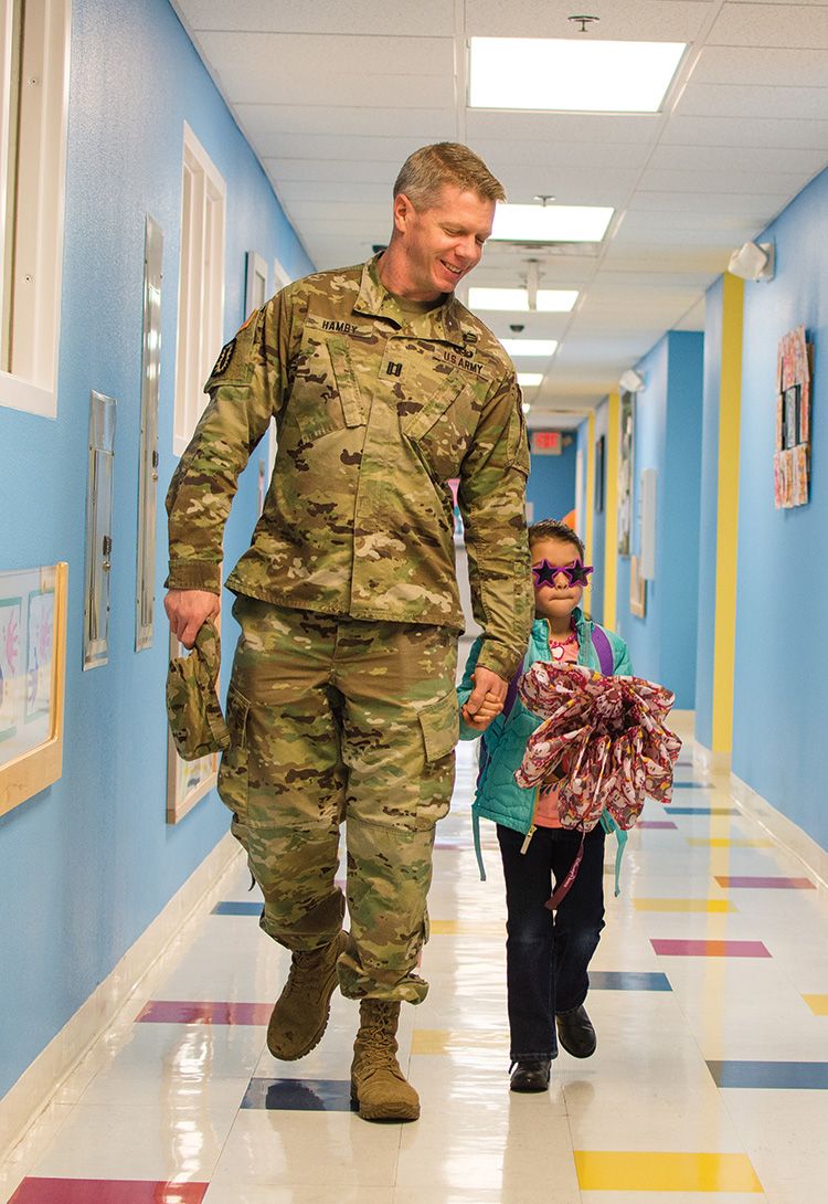 soldier_w_daughter_cdc_optimized.jpg